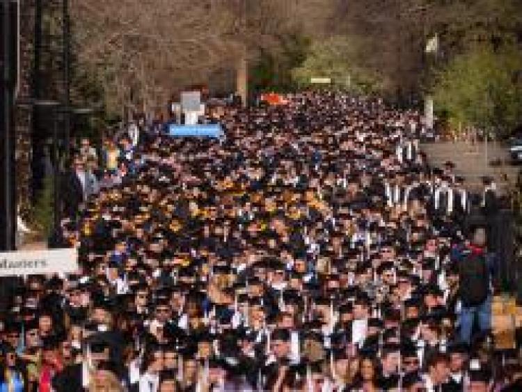 Graduates Walking Across Campus