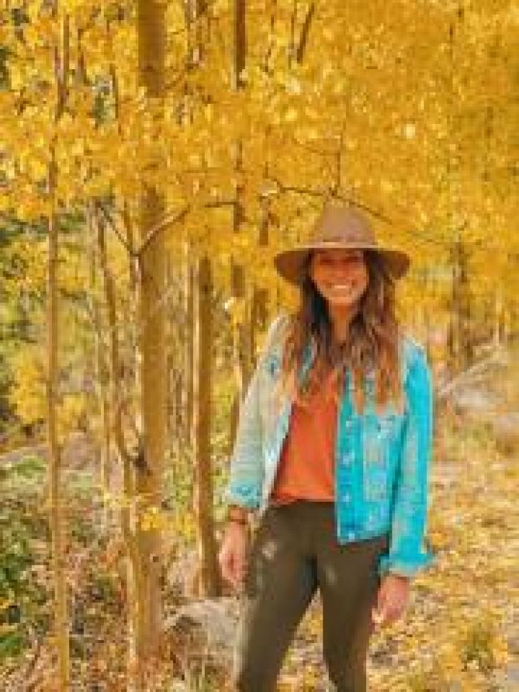 Cassie Elrod among fall trees