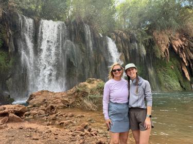 McNiece poses with her mom in front of Fifty Foot Falls