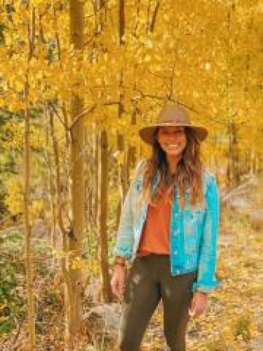 Cassie Elrod among fall trees