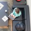 view of woman working on laptop from above